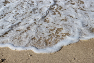 Sea wave rolling on the coast rocks