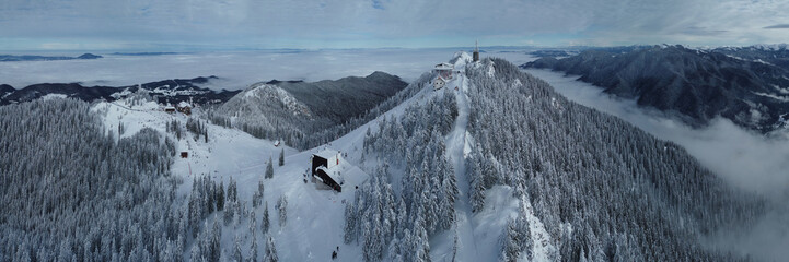 Aerial panorama view from a drone of Poiana Brasov ski resort from Transylvania, Romania, with sea...