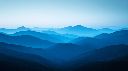 Majestic blue mountain range under a serene morning sky