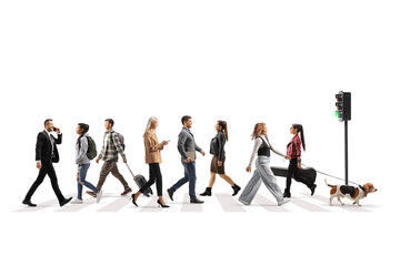 Crowded street with pedestrians, busy people crossing at green traffic light