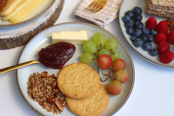 Assortment of various breakfast foods and drinks on the white table. Selective focus.