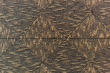 Fototapeta premium A patterned cloth with a brown and black color scheme