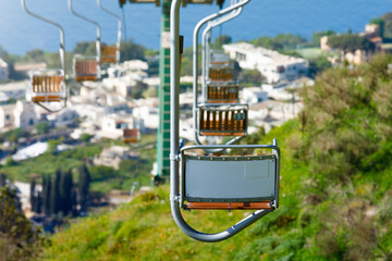 Scenic chairlift ride offers stunning panoramic views of Mediterranean Sea and charming town of...