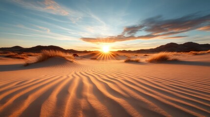 A stunning sunset casts warm colors over rolling sand dunes, highlighting the patterns created by the wind and evoking a sense of peace and wonder in the tranquil desert.