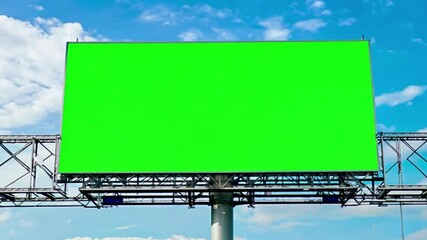 Green screen on a large billboard at a stadium, perfect for advertisement or promotional use