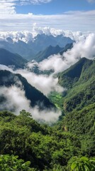 Obraz premium Majestic mountain landscape with clouds and lush greenery under a bright sky