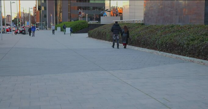  Romantic Couple Holding Hands Walking in a Charming City Center