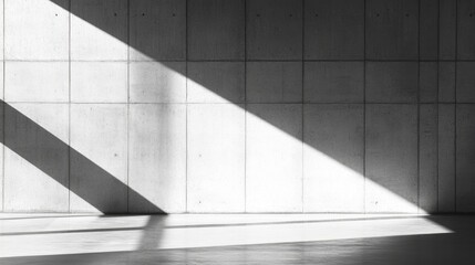 Fototapeta premium Abstract Gray Concrete Wall with Dramatic Light and Shadow Play