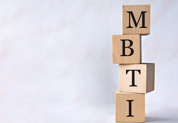 MBTI - word on wooden cubes on a white background
