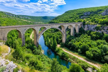 A scenic view of a historic stone viaduct