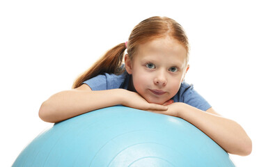 Fototapeta premium Cute little girl with fitness ball on white background