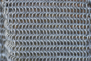 A close up of a metal chain with many small links