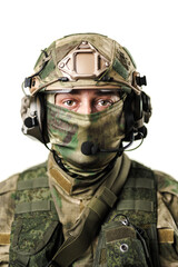 Professional soldier in camouflage gear and tactical equipment standing ready