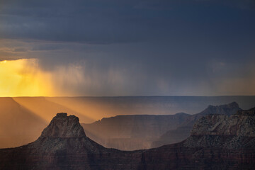 Naklejka premium USA, Arizona, Grand Canyon National Park. Thunderstorm on North Rim at sunset.