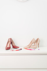 Nail polish palette in a beauty salon and stiletto heels