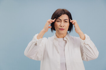 Mature Woman Suffering From Strong Headache or Migraine Attack