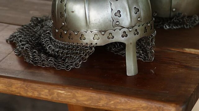 Close-up of a medieval Viking helmet, smooth camera movement, selective focus.
