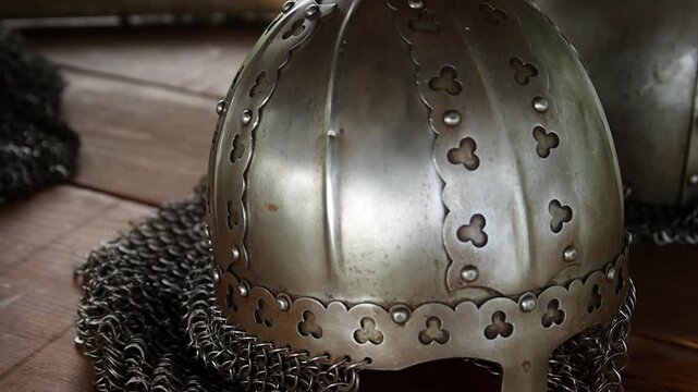 Close-up of a medieval Viking helmet, smooth camera movement, selective focus.
