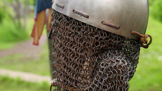 Close-up of a medieval Viking helmet, smooth camera movement, selective focus.
