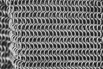 A close up of a metal chain with many small links