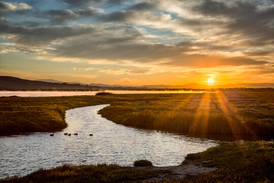 USA, California, Central Coast, Lompoc. Sunrise over the Santa Ynez River from Ocean Beach Park