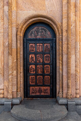 Doors with religious images in the Christian Orthodox Church of the Holy Trinity