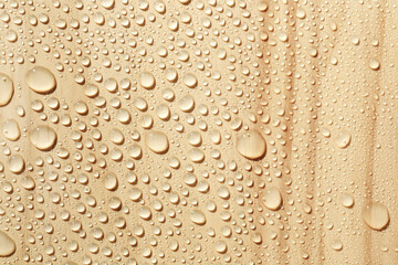 Water drops on wooden surface, close-up