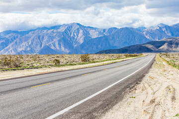 Borrego Springs, California, USA. Highway in a mountain valley in the California desert.