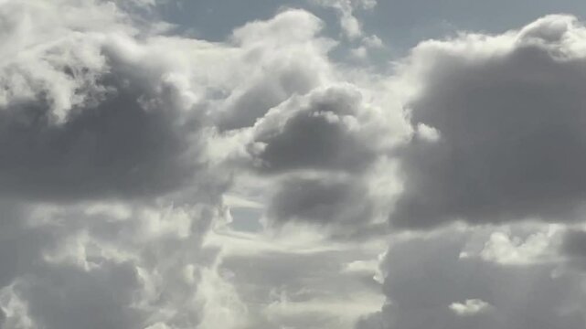 Movement of cumulus clouds with pronounced circular circulation of water vapor. Tenfold speed. Majorca Island. Spain.
