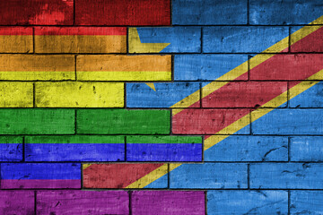 colourful painted big flag of democratic republic of the congo and rainbow gay pride flag on a massive old brick wall background. concept
