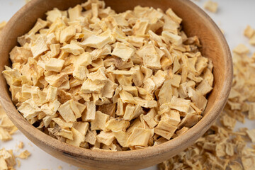 Dry parsley root, dried diced celery cubes, scattered small liquorice pileces, dry vegetable