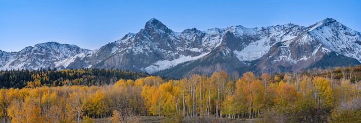 USA, Colorado, Uncompahgre National Forest. Panoramic sunset on aspen forest and Sneffels Range.