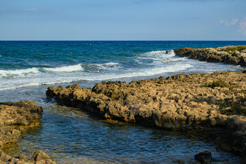Rocky Coastline with Turquoise Waves Crashing Ashore