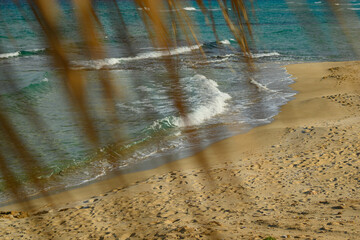 Calm Beach Scene with Sand and Gentle Waves