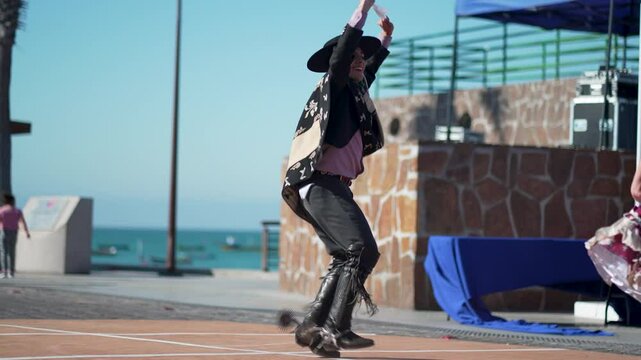 Energetic chilean dancers showcase traditional cueca moves, celebrating their heritage with vibrant costumes and handkerchiefs