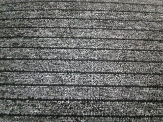 Black fabric background with parallel lines