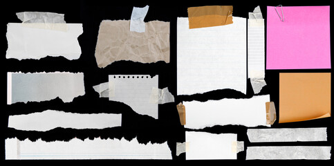 Torn papers on black background