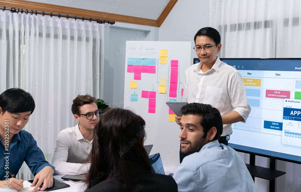 Leinwandbilder Project manager communicate and collaborate with team using project management software display on monitor, tracking progress of project task and making schedule plan at meeting table. Prudent