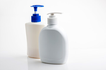 Mockup of white plastic bottle for liquid soap or shampoo with blank label.