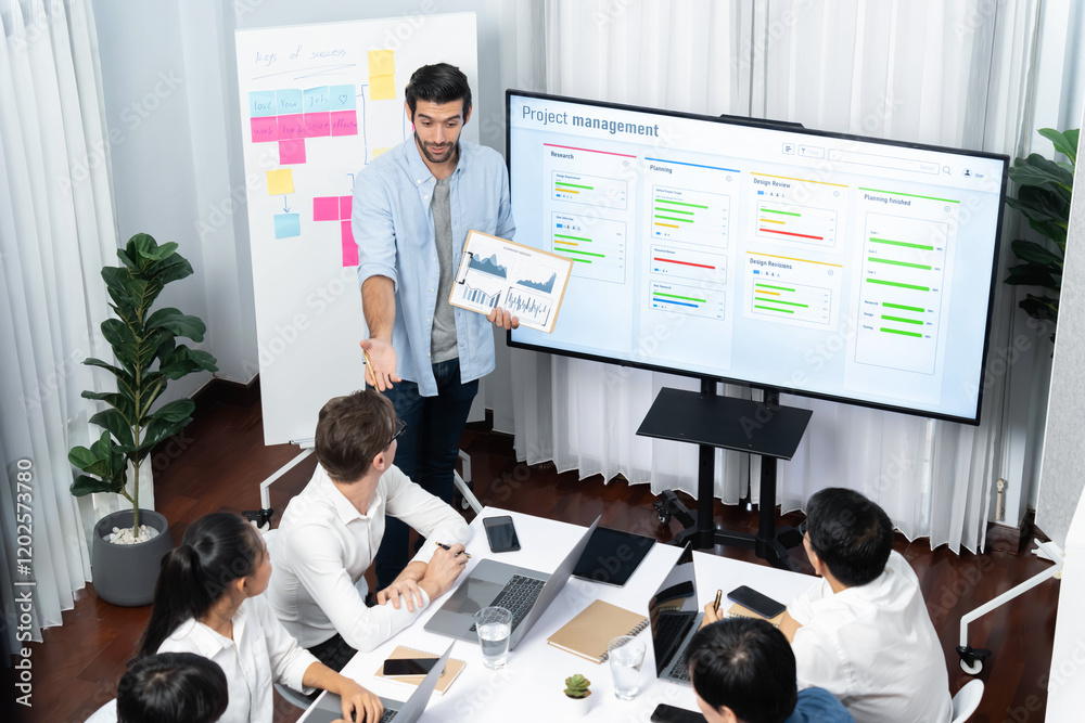 Leinwandbilder Project manager communicate and collaborate with team using project management software display on monitor, tracking progress of project task and making schedule plan at meeting table. Prudent