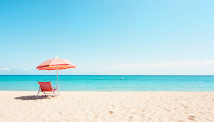 Fototapeta premium Sunlounger with striped umbrella on a sandy beach