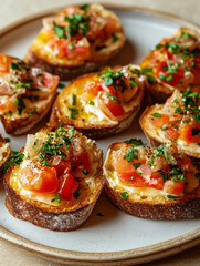 Bruschetta with tomatoes and herbs on a white plate.