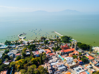 Chapala town and lake in Jalisco, Mexico, featuring church, pier and boats