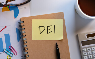 There is sticky note with the word DEI. It is an abbreviation for Diversity, Equity, Inclusion as...
