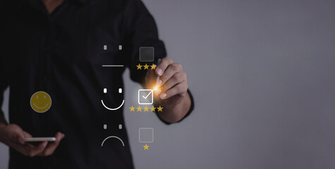 Customer Review, Young man with smartphone mobile hand holding a pen touching to five star to...