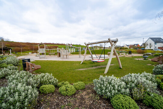 Newly built development residential area children outdoor kid playground and park in England