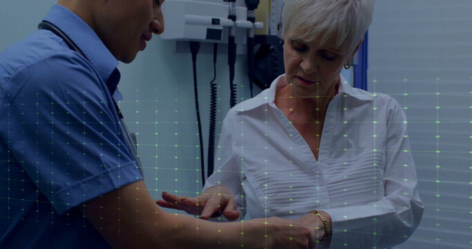 Image of cardiograph over biracial male doctor examining his patient