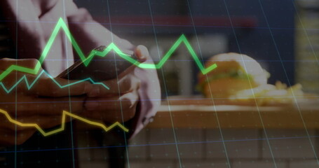 Image of data processing and diagrams over biracial man using smartphone