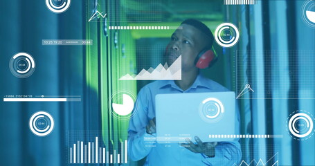 Image of financial data processing over african american businessman working in server room