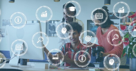 Image of business icons and data processing over diverse business people in office